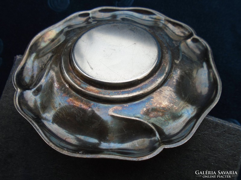A small bowl with a silver-plated patina with an Art Nouveau embossed rim
