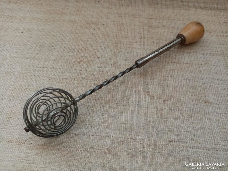 Old wooden handle spring whisk in usable condition