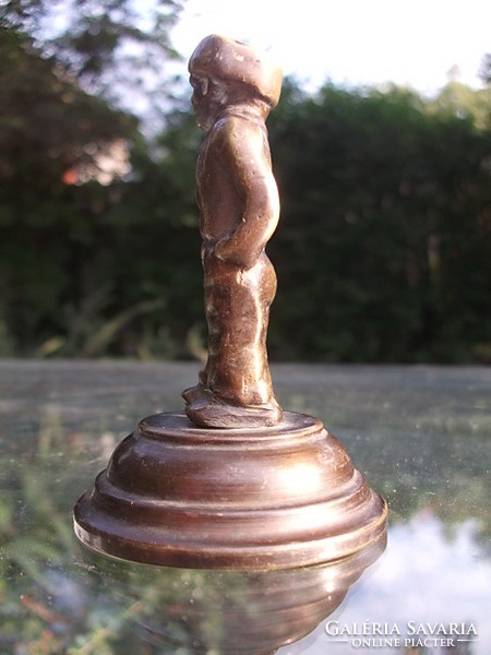 A bronze statue of a male figure for a desk, decoration