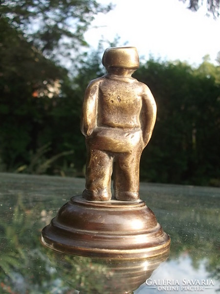 A bronze statue of a male figure for a desk, decoration