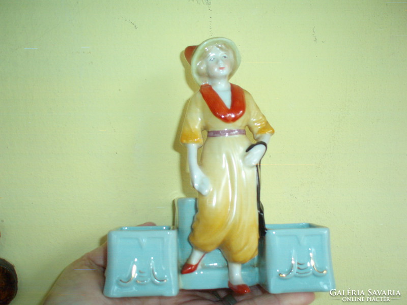 Porcelain female figurine in antique spice rack