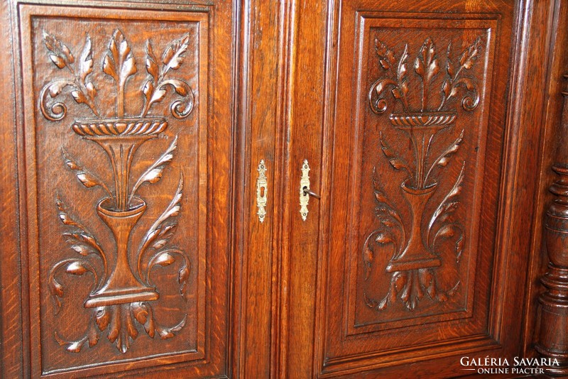 Tin German, richly carved chest of drawers made of oak