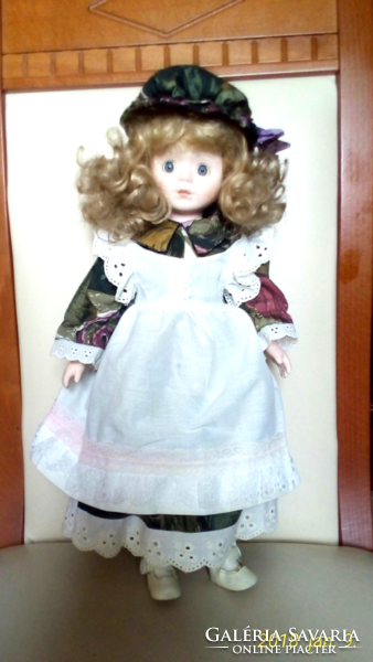 Antique porcelain doll with a hat, 40 cm high, in excellent condition