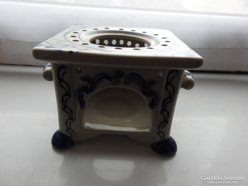 Old porcelain hob with candle holder with cobalt blue painting