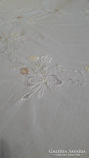 Embroidered tablecloth with perforated decoration
