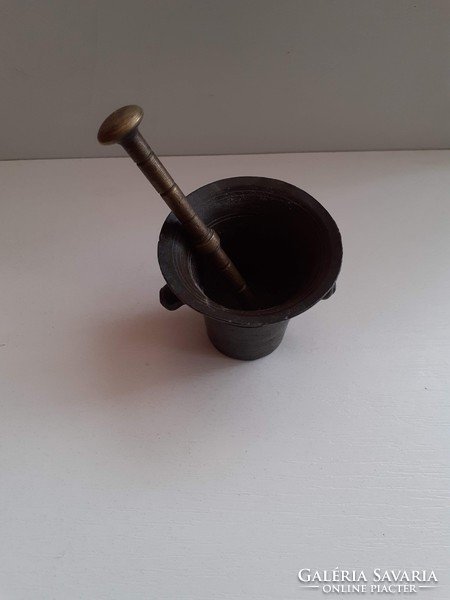 Old small copper mortar with pestle