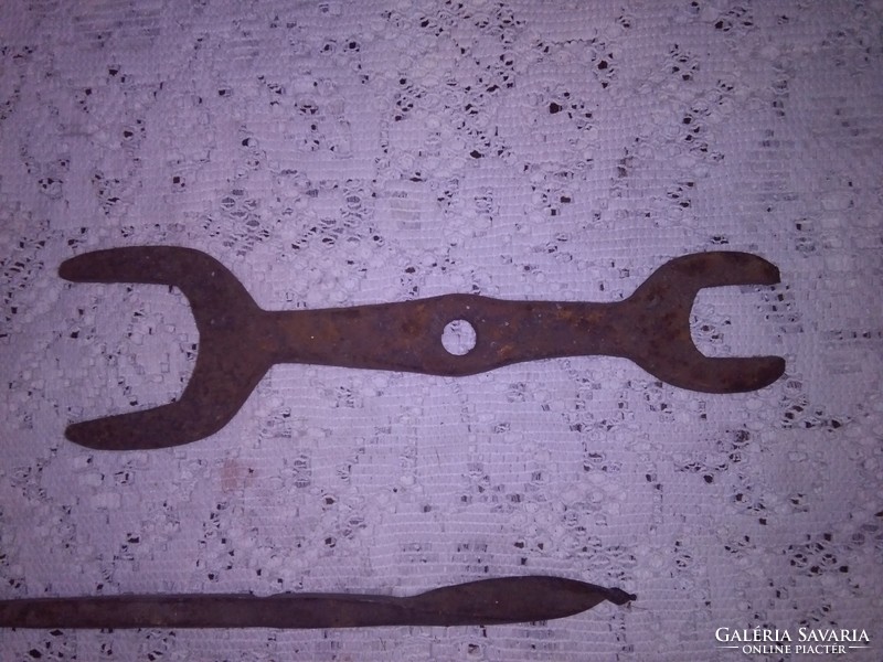 Old wrought iron hand tool - three pieces together - chisel, key, drill