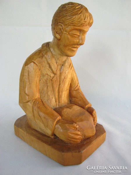 Signed carved wooden statue