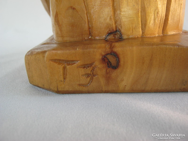 Signed carved wooden statue