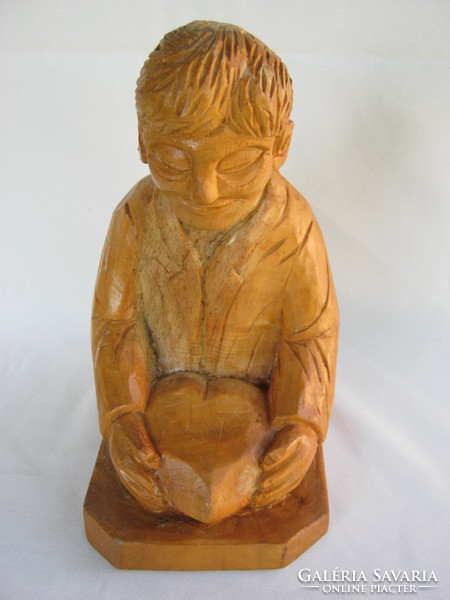 Signed carved wooden statue