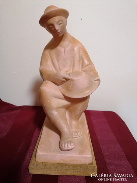 Béla Kucs terracotta sculpture of a man holding a bowl