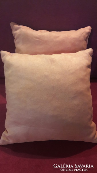 2 orange decorative pillows