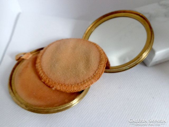 Powder with a compact mirror and a beautiful 