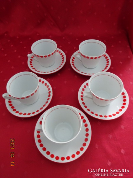 Lowland porcelain, red polka dot tea cup + placemat. He has!