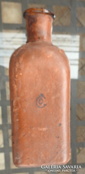 Old leather covered glass bottle