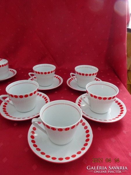 Lowland porcelain, red polka dot tea cup + placemat. He has!