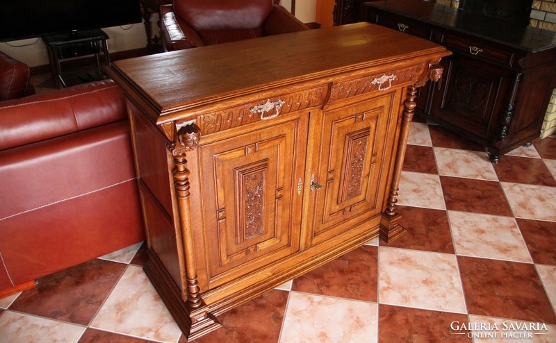 Tin German, richly carved oak chest of drawers