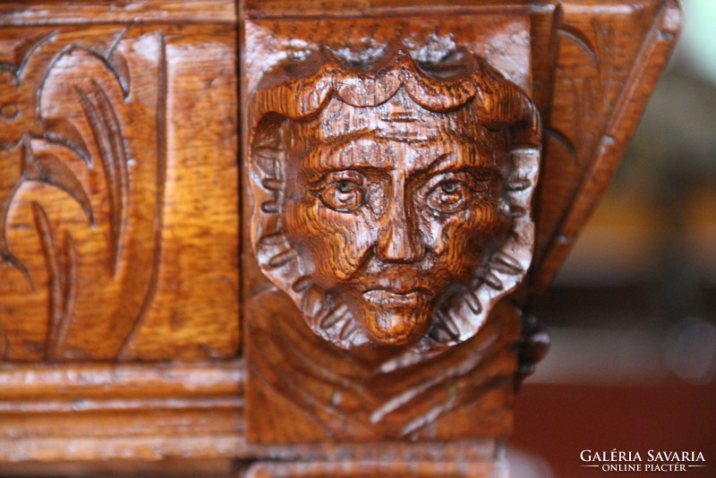 Tin German, richly carved oak chest of drawers