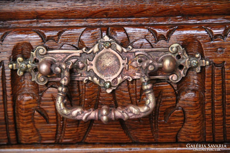 Tin German, richly carved oak chest of drawers