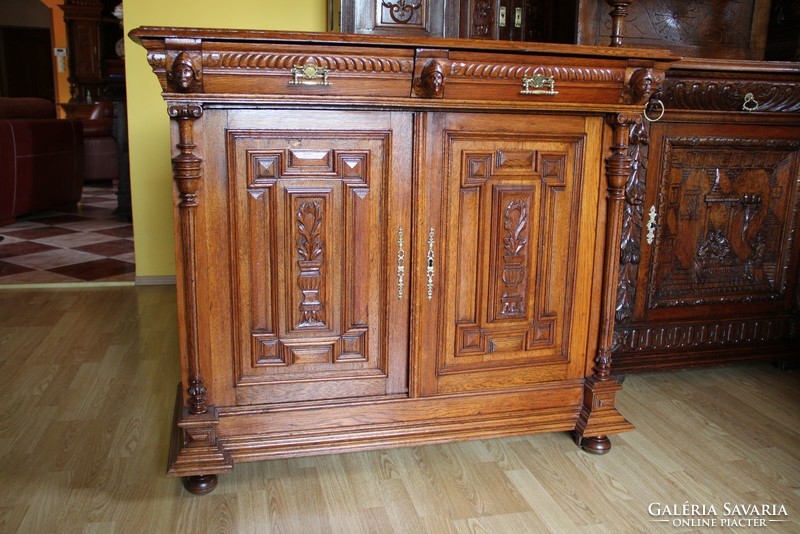Old German richly carved oak chest of drawers