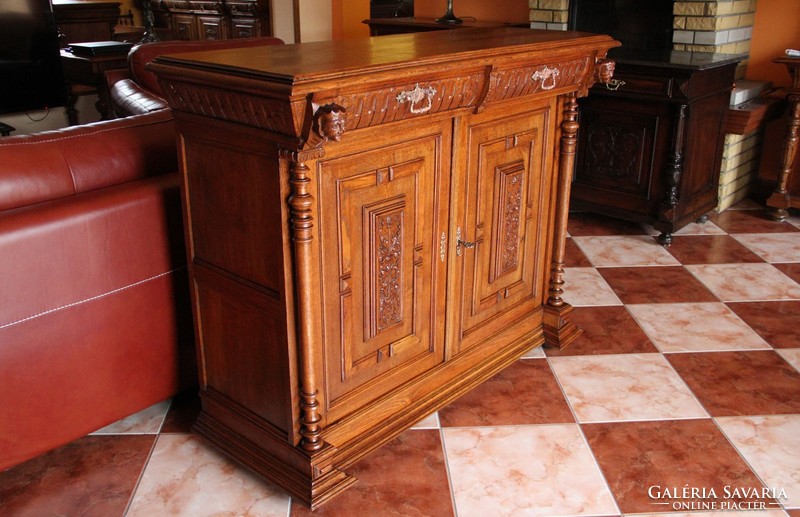 Tin German, richly carved oak chest of drawers