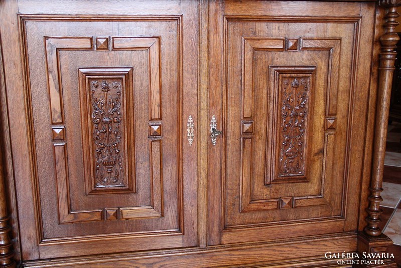 Tin German, richly carved oak chest of drawers