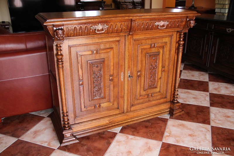 Tin German, richly carved oak chest of drawers