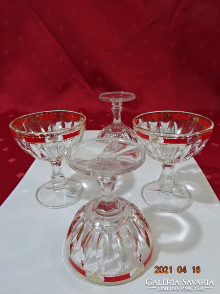 Glass goblet with stem, four pieces for sale, with red and gold decoration on the edge. He has!