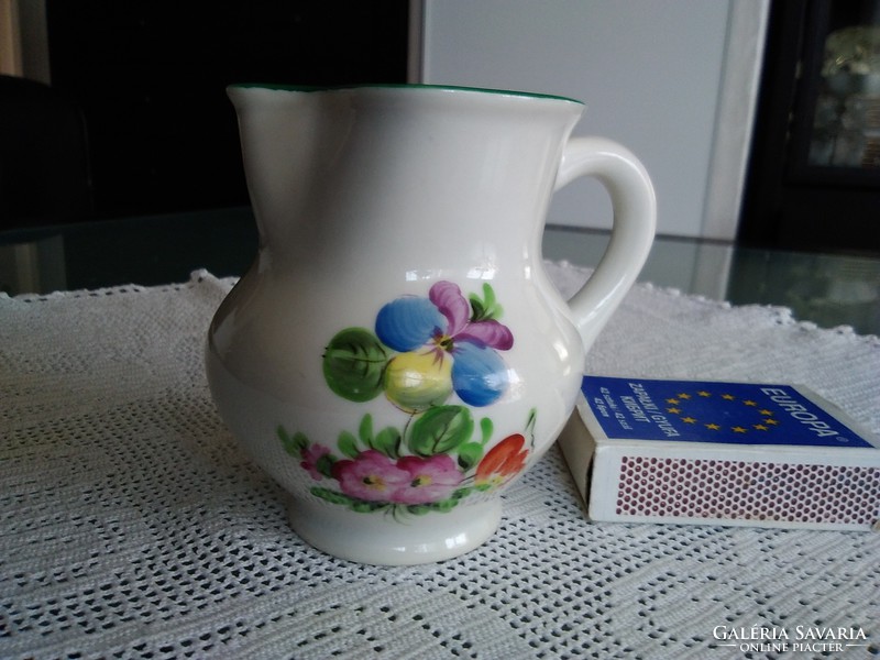 Old Herend porcelain mini milk jug with a green border and pattern characteristic of the age.