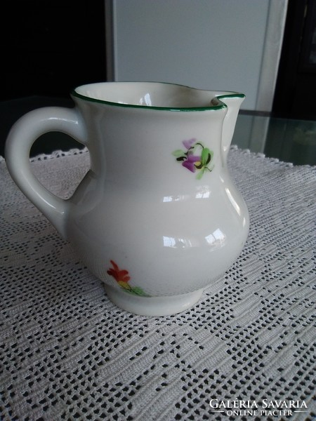 Old Herend porcelain mini milk jug with a green border and pattern characteristic of the age.