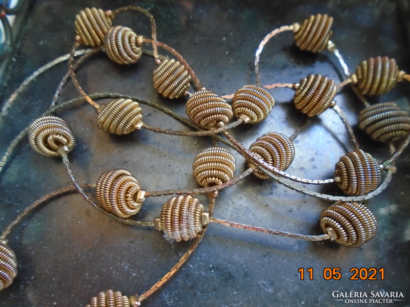 Very interesting, decorative neck blue gold colored thin spiral coil of pearls on a gilded necklace