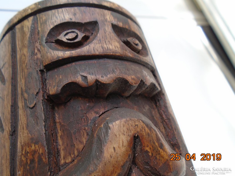 Wood carving magical face, column