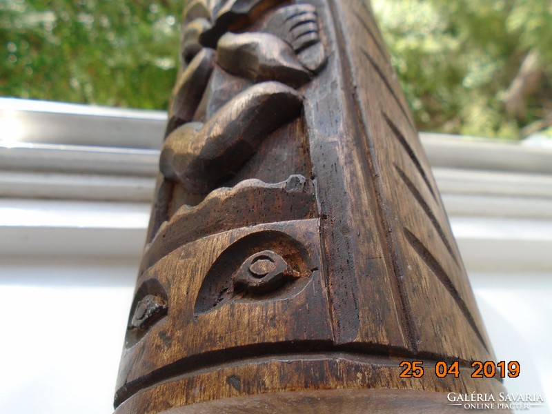 Wood carving magical face, column