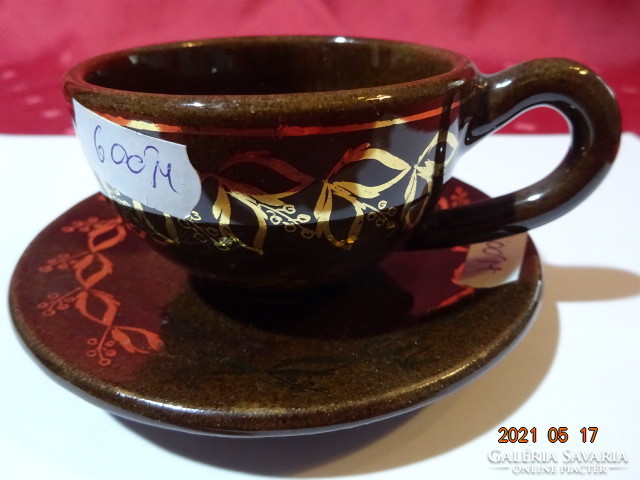 Chocolate brown glazed ceramic coffee cup + placemat. He has!