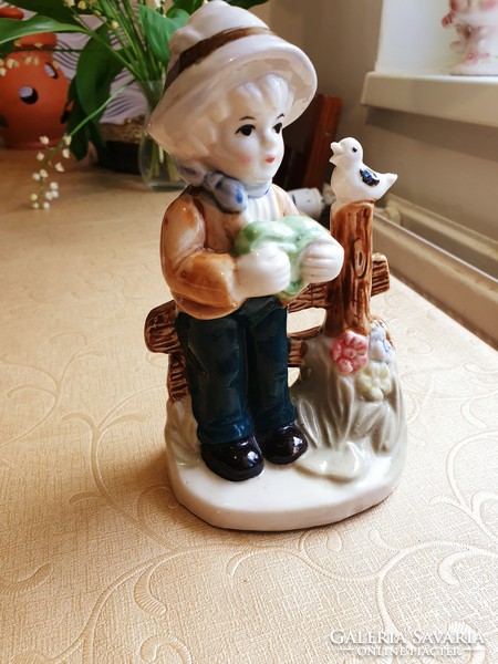 Antique porcelain figurine, little boy with bird for sale!