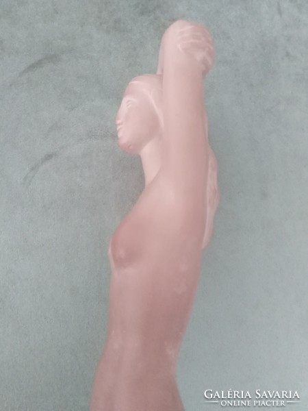 Spherical ceramic sculpture of a female nude