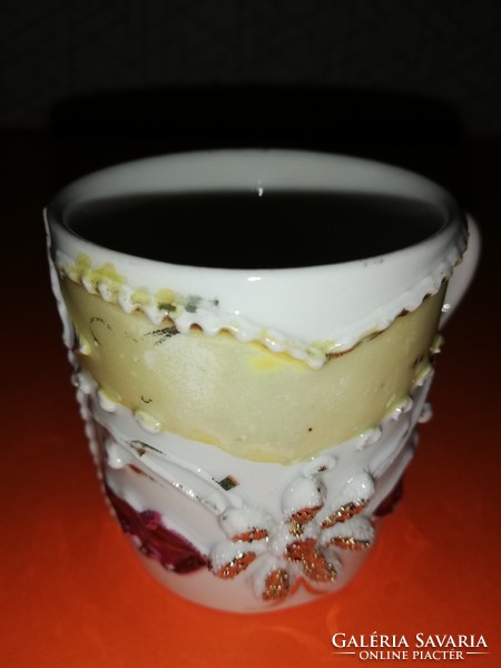 Old coffee cup with pastiche decoration