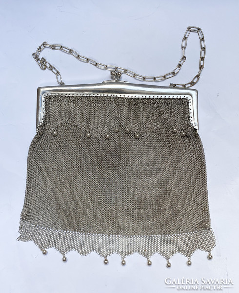 Silver-plated theater bag.