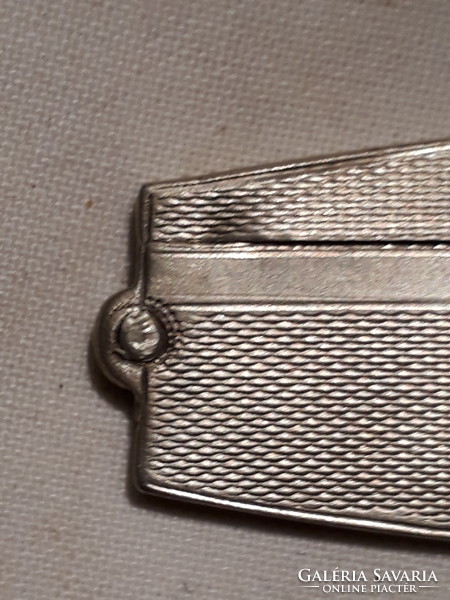 Marked silver comb holder (with greyhound head).