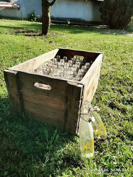 Retro glass bottles in a rustic wooden box