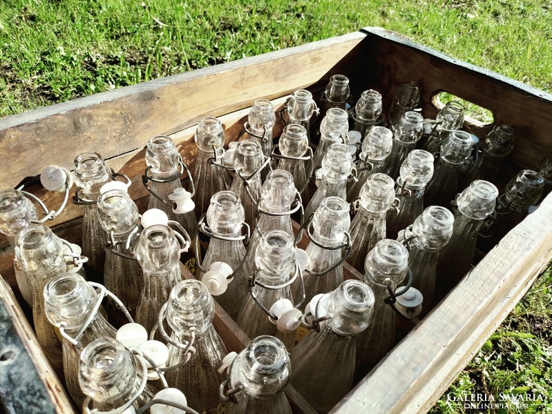 Retro glass bottles in a rustic wooden box