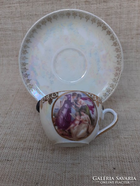 Old beautiful thin scene gilded porcelain coffee cup with saucer