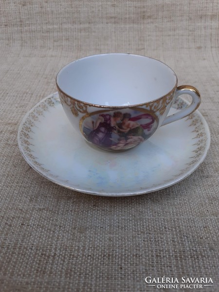 Old beautiful thin scene gilded porcelain coffee cup with saucer