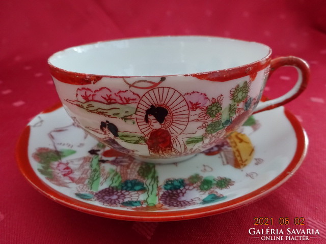 Japanese porcelain teacup + placemat. He has!