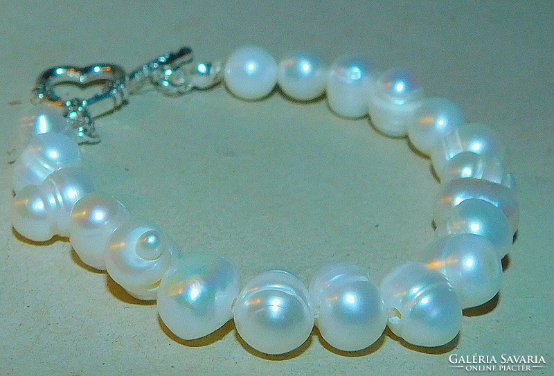 Off-white round eyed real pearl bracelet with ornate clasp