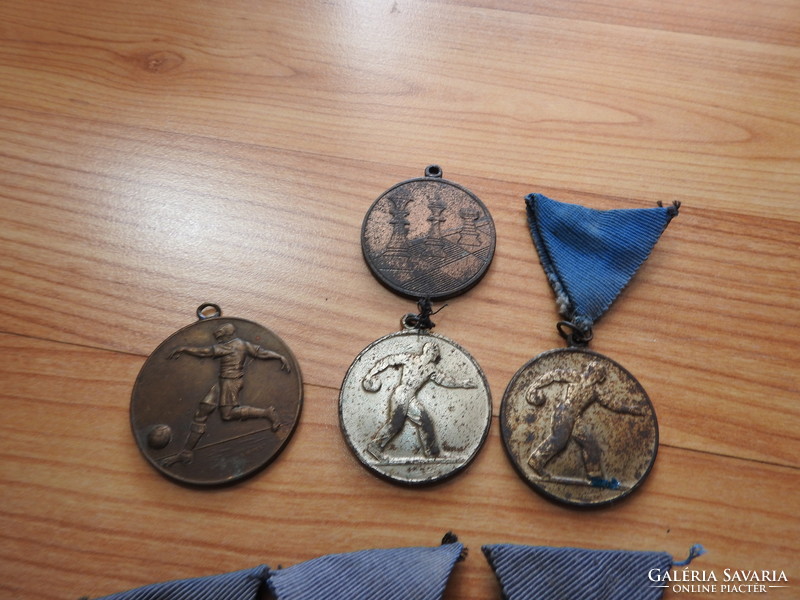 6 old sports coins together