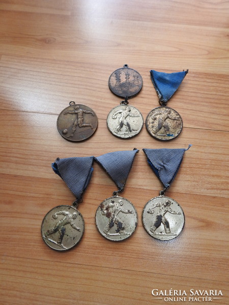 6 old sports coins together
