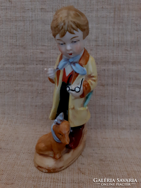 Old sealed numbered German porcelain boy with dog