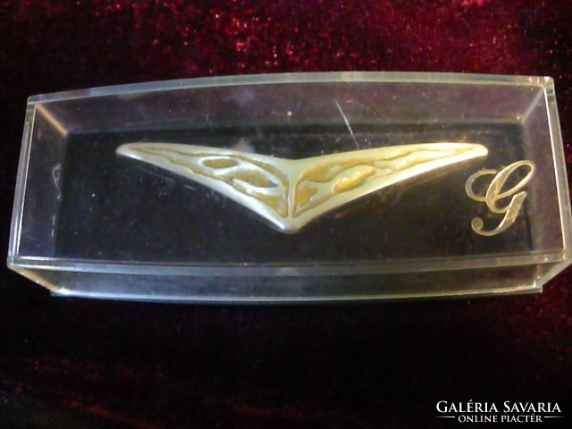 In a silver-plated badge box