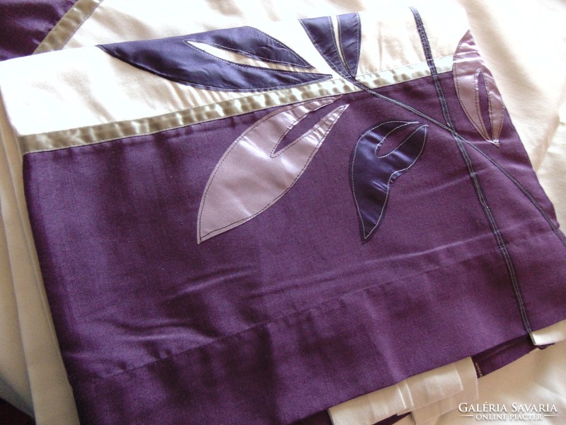 A pair of beautiful purple cream blackout curtains